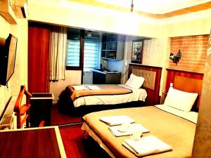 TV a/nebo společenská místnost v ubytování Istanbul Sydney Hotel