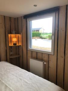 Postel nebo postele na pokoji v ubytování Chalet des Campanules avec Sauna