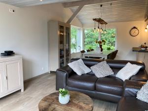 Posezení v ubytování Chalet des Campanules avec Sauna