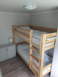 a bedroom with two bunk beds in a room at Ośrodek Wypoczynkowy Caritas in Wałcz