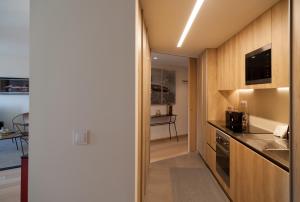 Virtuvė arba virtuvėlė apgyvendinimo įstaigoje FLH Marquês Homey Apartment