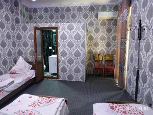 Ένα ή περισσότερα κρεβάτια σε δωμάτιο στο Ibragim-bek