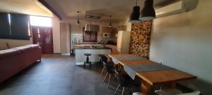 a kitchen and dining room with a table and chairs at Casa-Grima in Grima