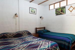 Postel nebo postele na pokoji v ubytování Le Petit Jardin