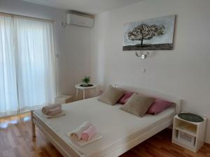 Postel nebo postele na pokoji v ubytování Rab - Apartman Matea