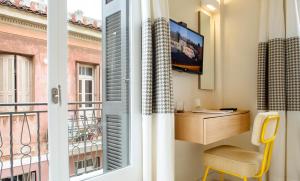 A television and/or entertainment centre at Athena hotel