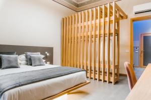 ETNEA Suite 270客房内的一张或多张床位