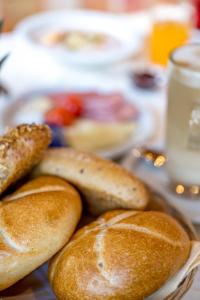 a plate of bread with buns on a table at Hotel Sölderhof in Sölden