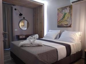 Кровать или кровати в номере Filia's Memories Apartments