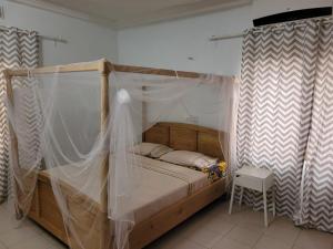 En eller flere senge i et værelse på Villa Anaël