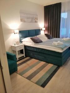 Ένα ή περισσότερα κρεβάτια σε δωμάτιο στο Aquamarina Onyx 18 +12 φωτογραφίες