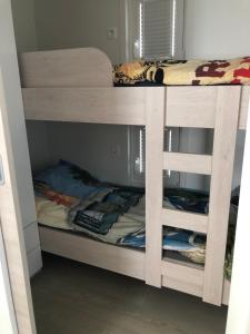 a bunk bed in a bunk room with a bunk bed in a room at Nalu Seahouse in Portorož