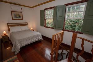 Postel nebo postele na pokoji v ubytování Pouso Jardim de Assis