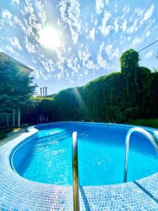 a swimming pool with a view of a mountain at Ridon Lux Hotel in Tashkent