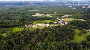 an aerial view of a house in a forest at La vallée des noyers in Beaulieu