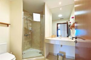 a bathroom with a shower and a sink at Salobre Morro Golf 1 in Salobre +16 photos