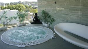 a bathroom with a bath tub and a sink at Hotel Spa Pinar del Mar in Platja d'Aro