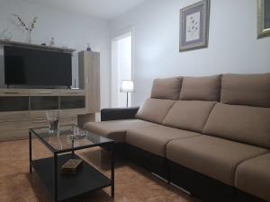 A seating area at Apartamentos Carlota