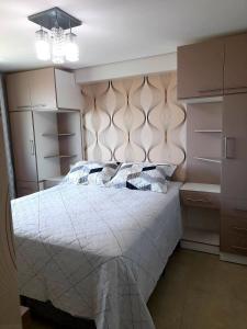 Ένα ή περισσότερα κρεβάτια σε δωμάτιο στο Ponta Negra RN01