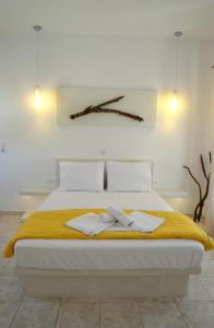 Ένα ή περισσότερα κρεβάτια σε δωμάτιο στο Niki Rooms