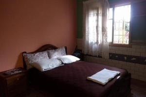 En eller flere senge i et værelse på Petite Villa à Sidi Rahal Plage