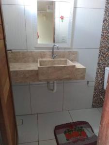 a bathroom with a sink and a mirror at pousada cangaço in São Gonçalo do Amarante
