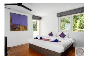 Postel nebo postele na pokoji v ubytování Panorama Samui Residences