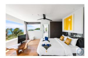 Postel nebo postele na pokoji v ubytování Panorama Samui Residences