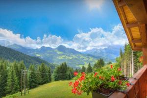 a balcony with a view of a mountain valley at Chalet de Paul et Marie - OVO Network in Manigod