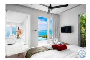 Postel nebo postele na pokoji v ubytování Panorama Samui Residences