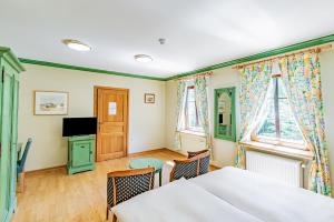 Vuode tai vuoteita majoituspaikassa Aux Tanneries de Wiltz