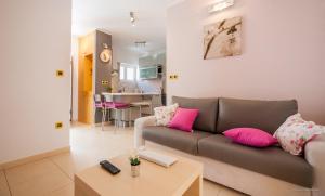 a living room with a couch and a table at Aldo Apartments Center in Zadar