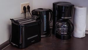 Příslušenství pro přípravu čaje a kávy v ubytování Appartementhaus- Bredner / Appartement II