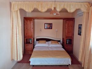 Posteľ alebo postele v izbe v ubytovaní Jázmin-Szieszta Apartmanház Balatonfüred