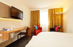 TV a/nebo společenská místnost v ubytování Hotel Metropol Basel