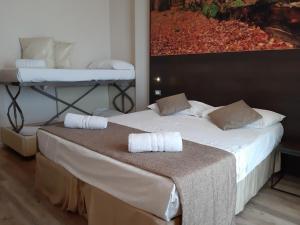 two beds in a room with two bunk beds at Hotel Life in Rimini