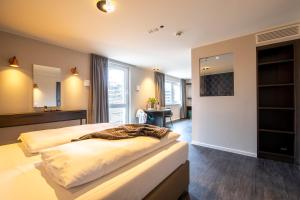 MASEVEN München Messe Dornach客房内的一张或多张床位