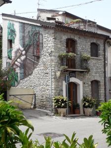 a building with a mural on the side of it at B&B Corso Italo Balbo in Satriano di Lucania