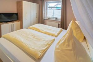 Ein Bett oder Betten in einem Zimmer der Unterkunft Ferienwohnung Ambiente