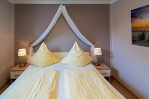 Ein Bett oder Betten in einem Zimmer der Unterkunft Ferienwohnung Ambiente