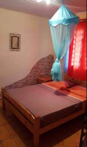 En eller flere senge i et værelse på Kactus-Kréyol