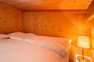 Łóżko lub łóżka w pokoju w obiekcie Chalet Sternwarte