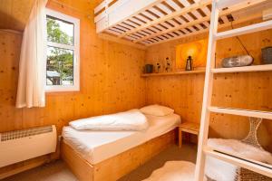 Łóżko lub łóżka w pokoju w obiekcie Chalet Sternwarte