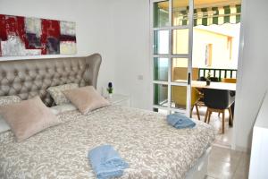 מיטה או מיטות בחדר ב-Quinta Azul