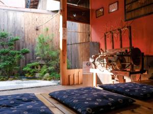a room with two large pillows on the floor at K-style kinkakuji in Kyoto