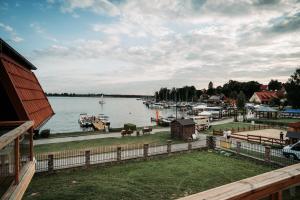 a view of a marina with boats in the water at Willa Z Widokiem na Jezioro in Ryn