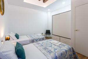 Łóżko lub łóżka w pokoju w obiekcie TACITA Family Home by Cadiz4Rentals