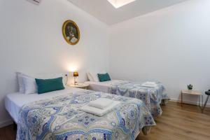 Łóżko lub łóżka w pokoju w obiekcie TACITA Family Home by Cadiz4Rentals