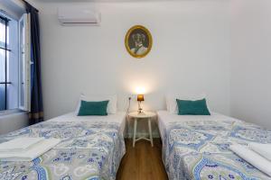 Łóżko lub łóżka w pokoju w obiekcie TACITA Family Home by Cadiz4Rentals