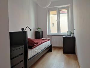 Posteľ alebo postele v izbe v ubytovaní APARTAMENT PRZY PARKU ŚRÓDMIEŚCIE